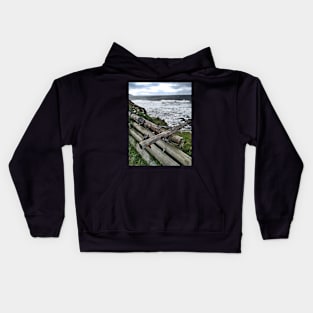 A stack of telegraph poles acting as a barrier, Kintyre, Scotland Kids Hoodie